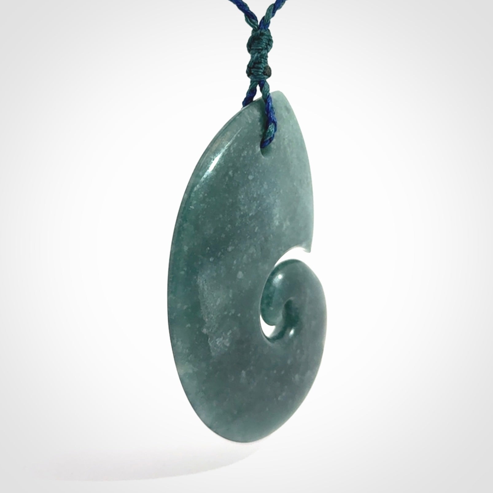 Hand carved Guatemalan Jade koru pendant.
