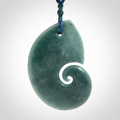 Hand carved Guatemalan Jade koru pendant.