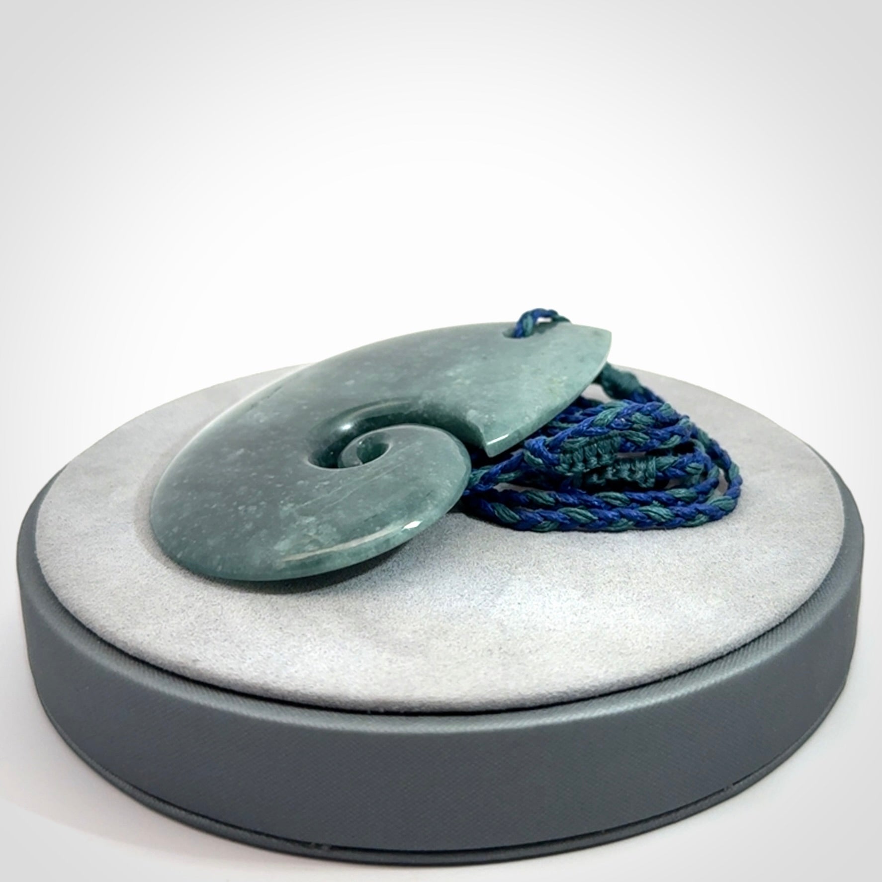 Hand carved Guatemalan Jade koru pendant.