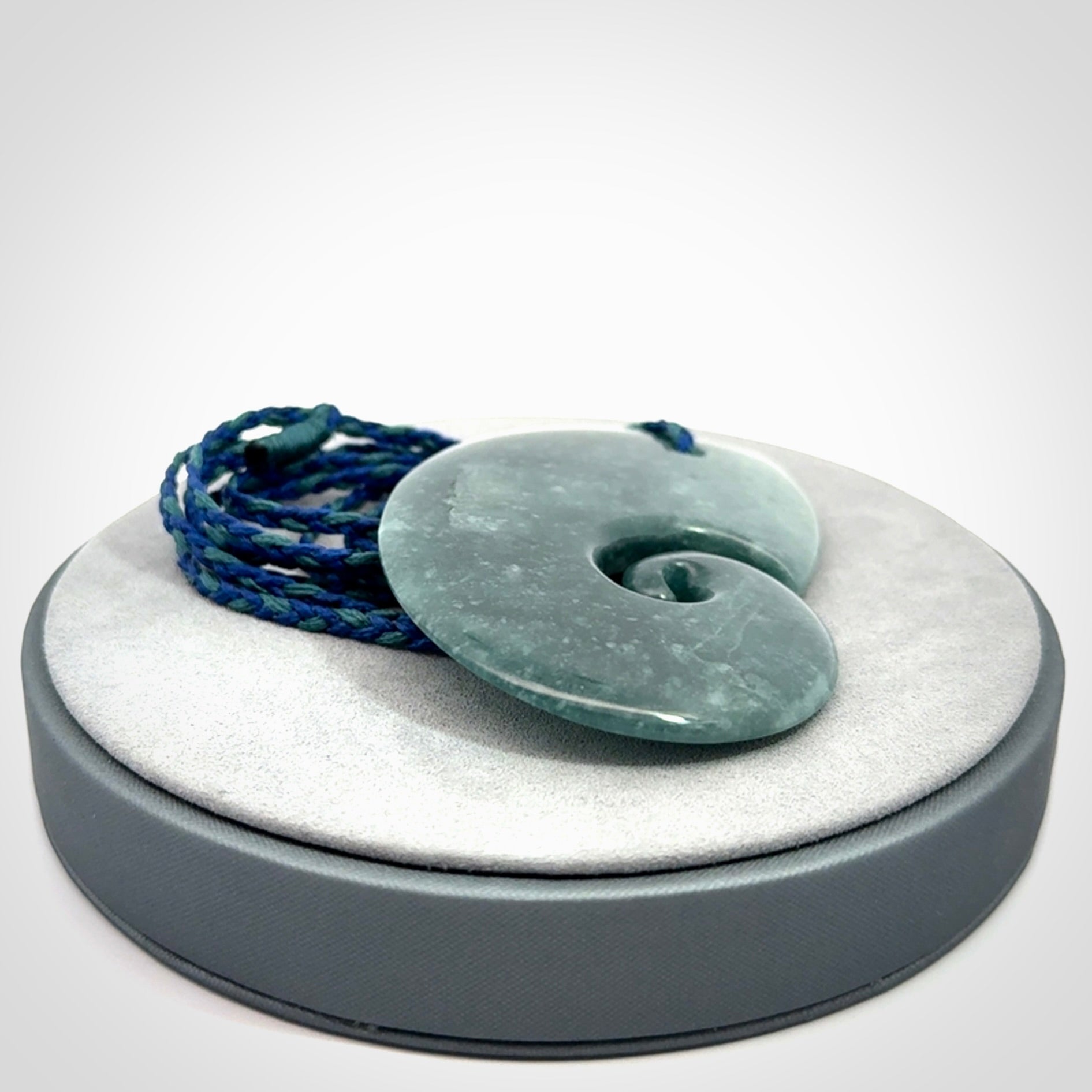 Hand carved Guatemalan Jade koru pendant.