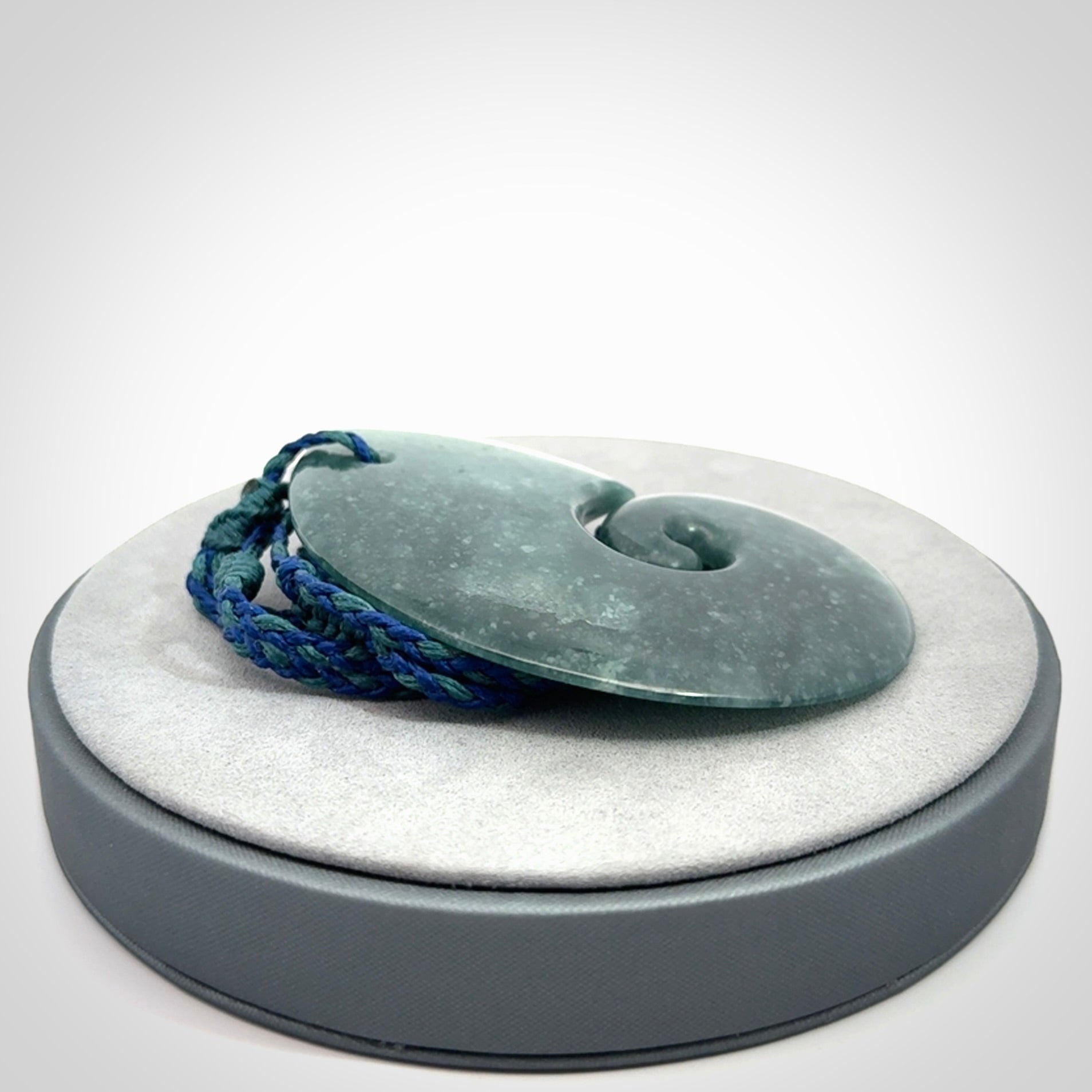 Hand carved Guatemalan Jade koru pendant.