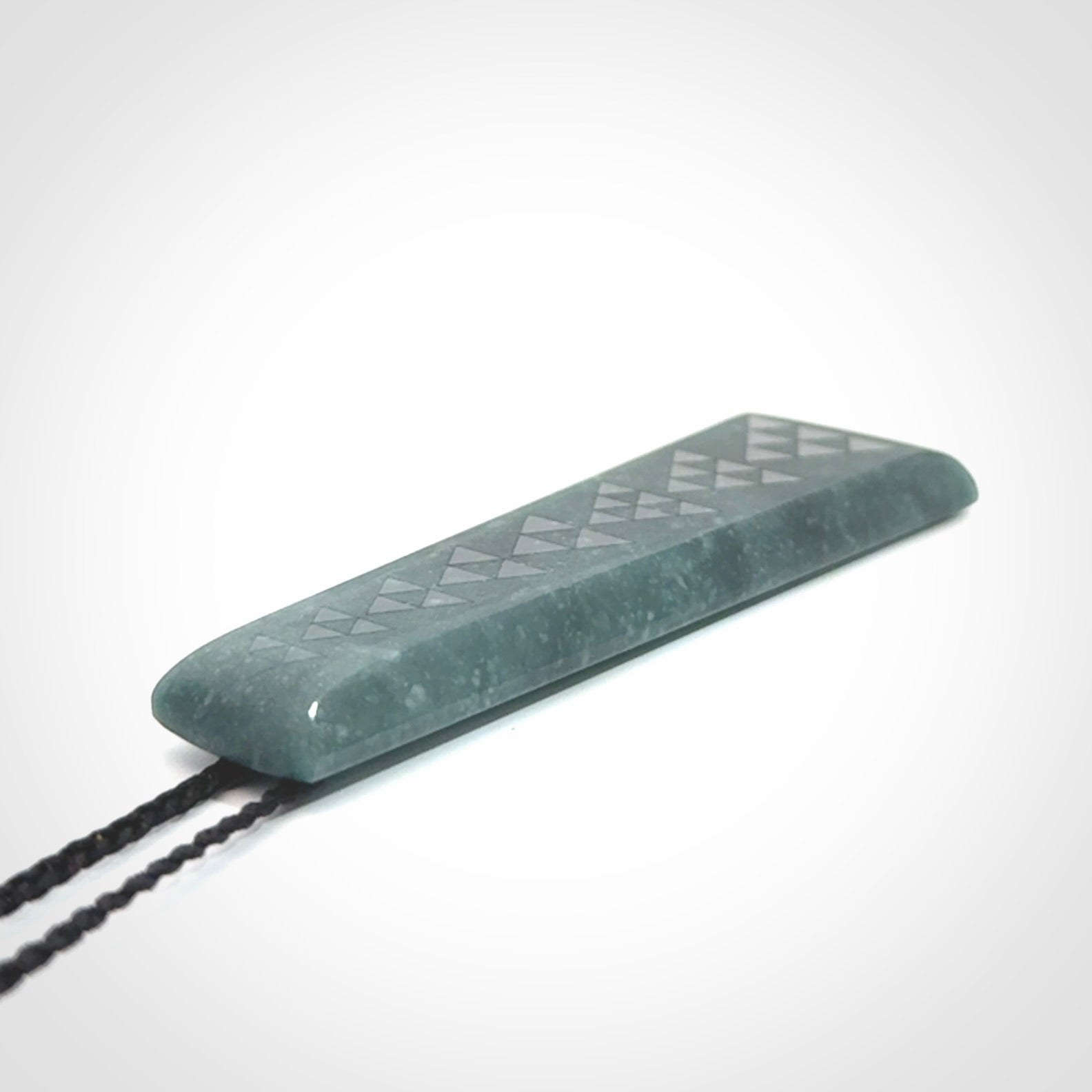 Hand carved large Guatemalan Jadeite Toki pendant.