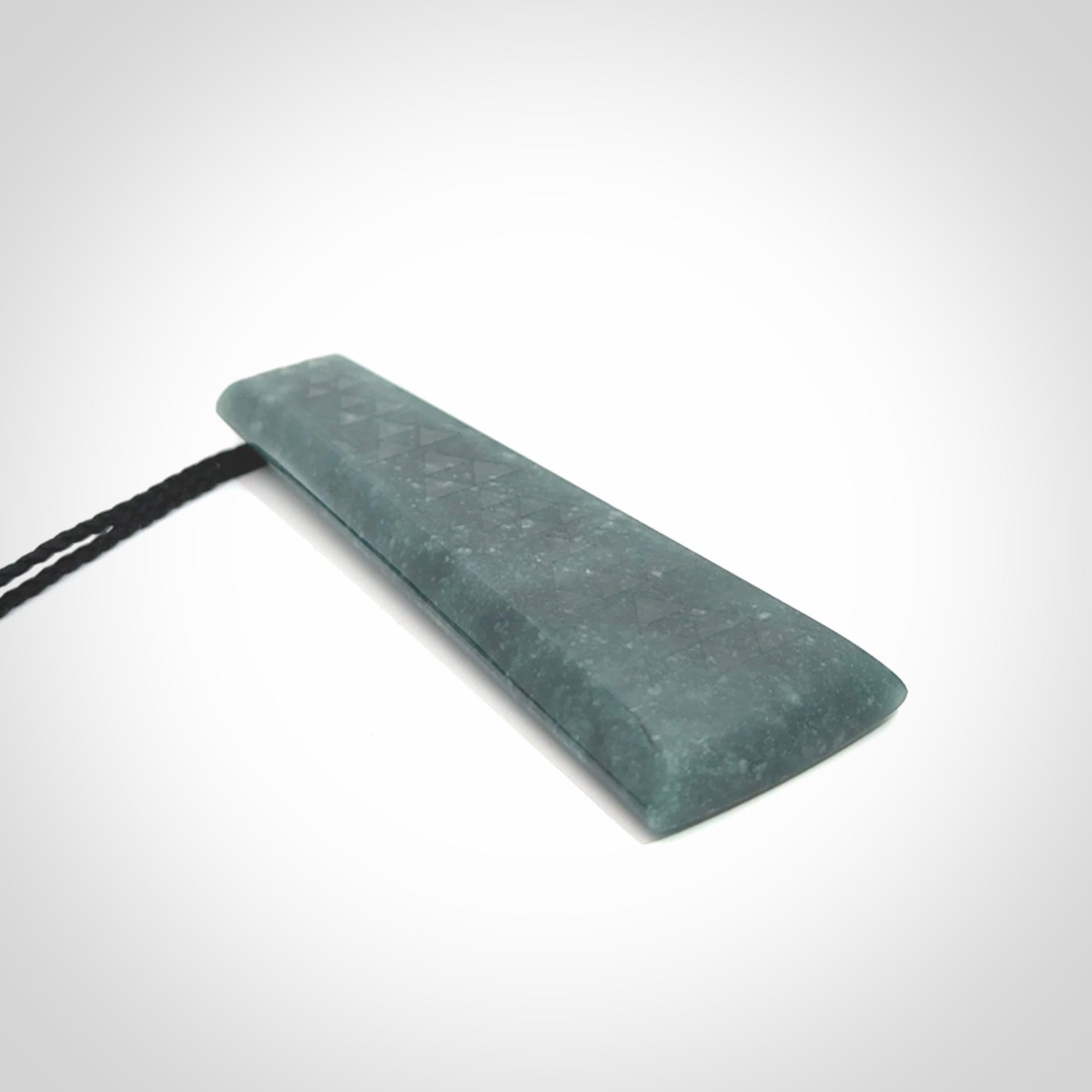 Hand carved large Guatemalan Jadeite Toki pendant.