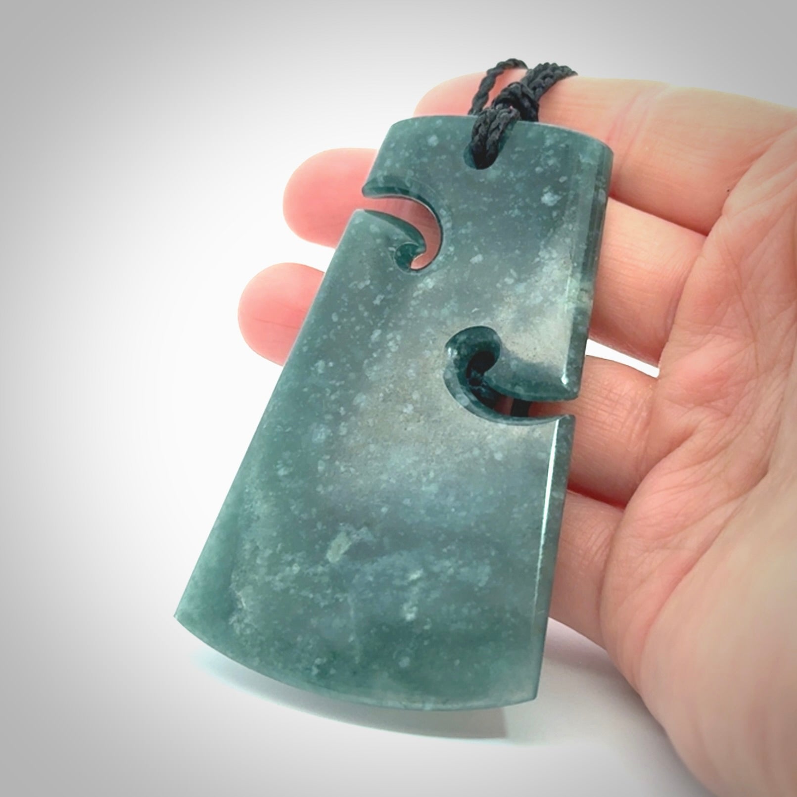 Hand carved large Guatemalan Jadeite Toki pendant.