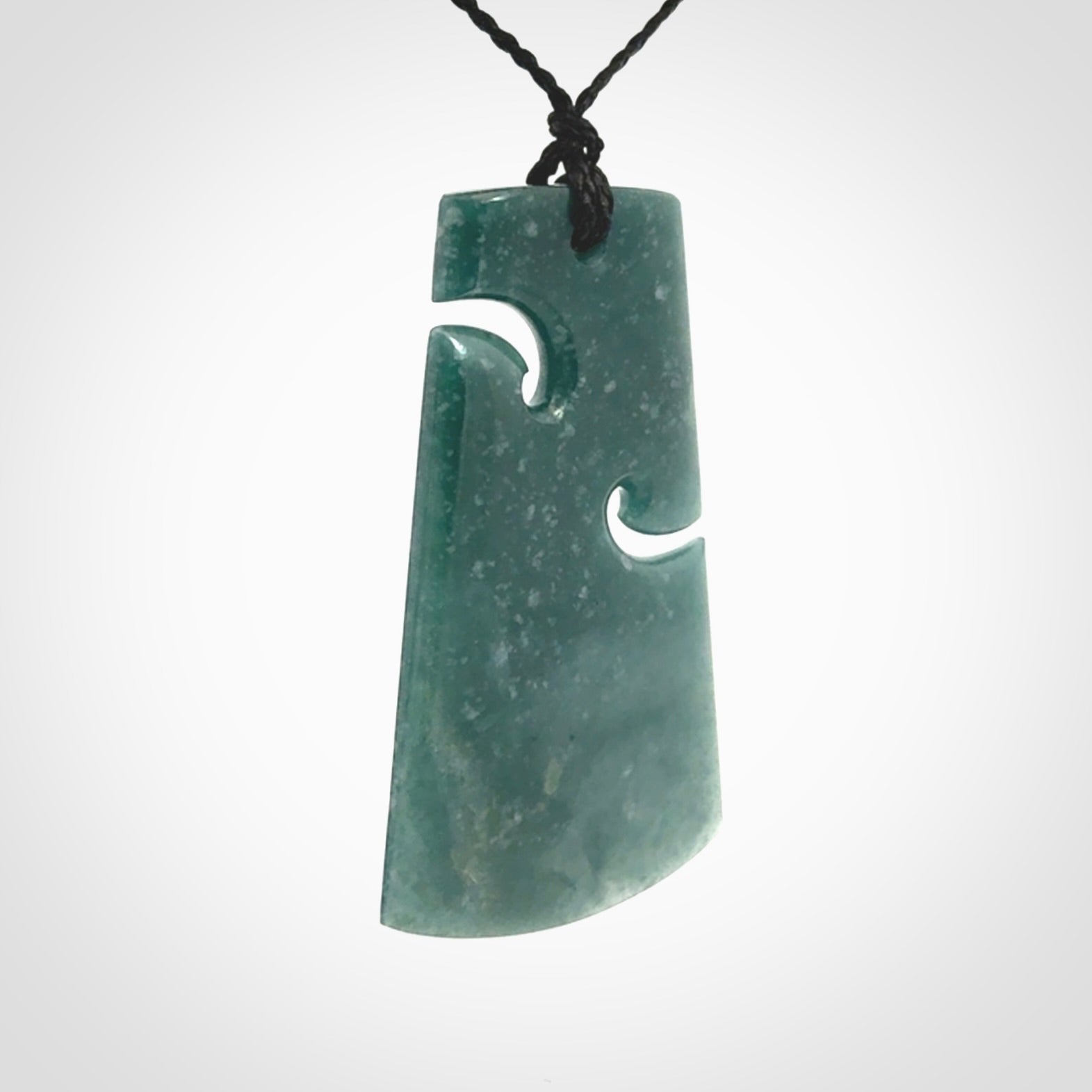 Hand carved large Guatemalan Jadeite Toki pendant.