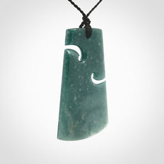 Hand carved large Guatemalan Jadeite Toki pendant.