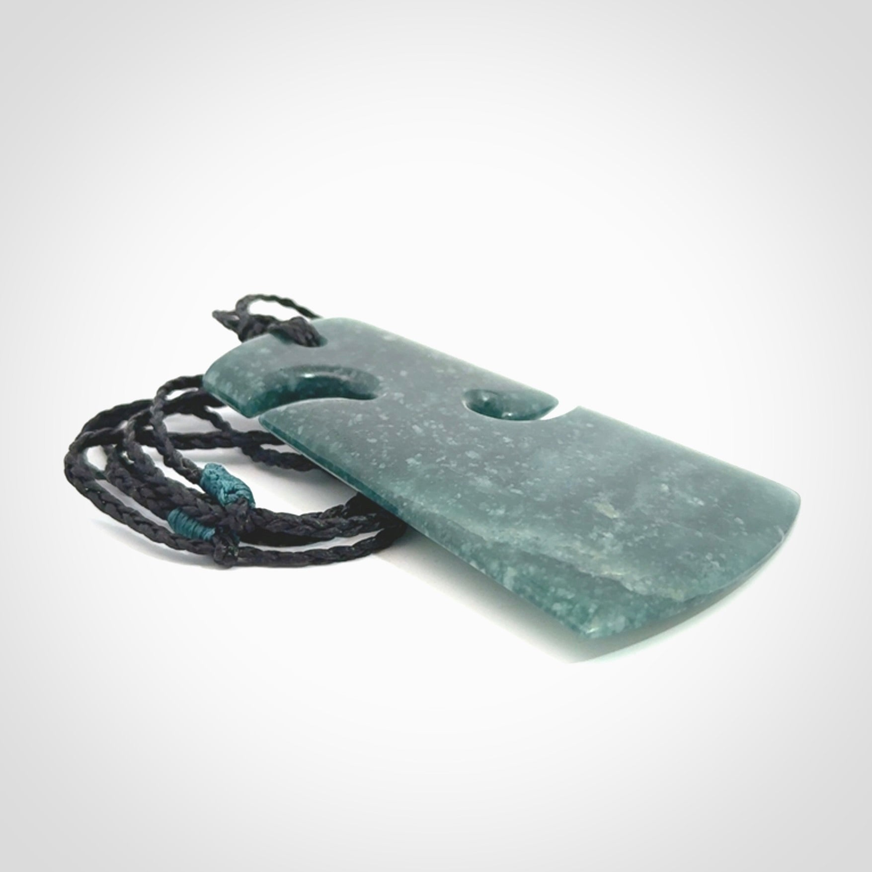 Hand carved large Guatemalan Jadeite Toki pendant.