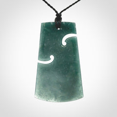 Hand carved large Guatemalan Jadeite Toki pendant.