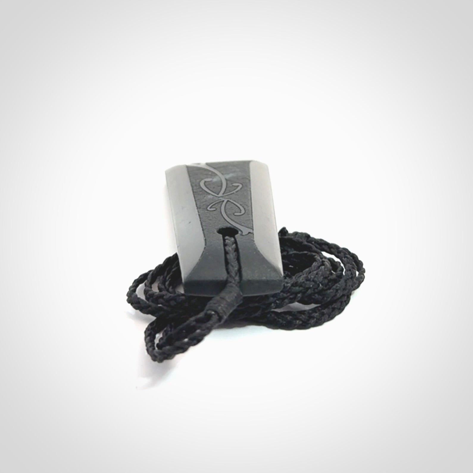 Hand made New Zealand Tangiwai toki with hammerhead engraving pendant. Hand carved in New Zealand by Kerry Thompson. Unique Jade Toki with adjustable cord.