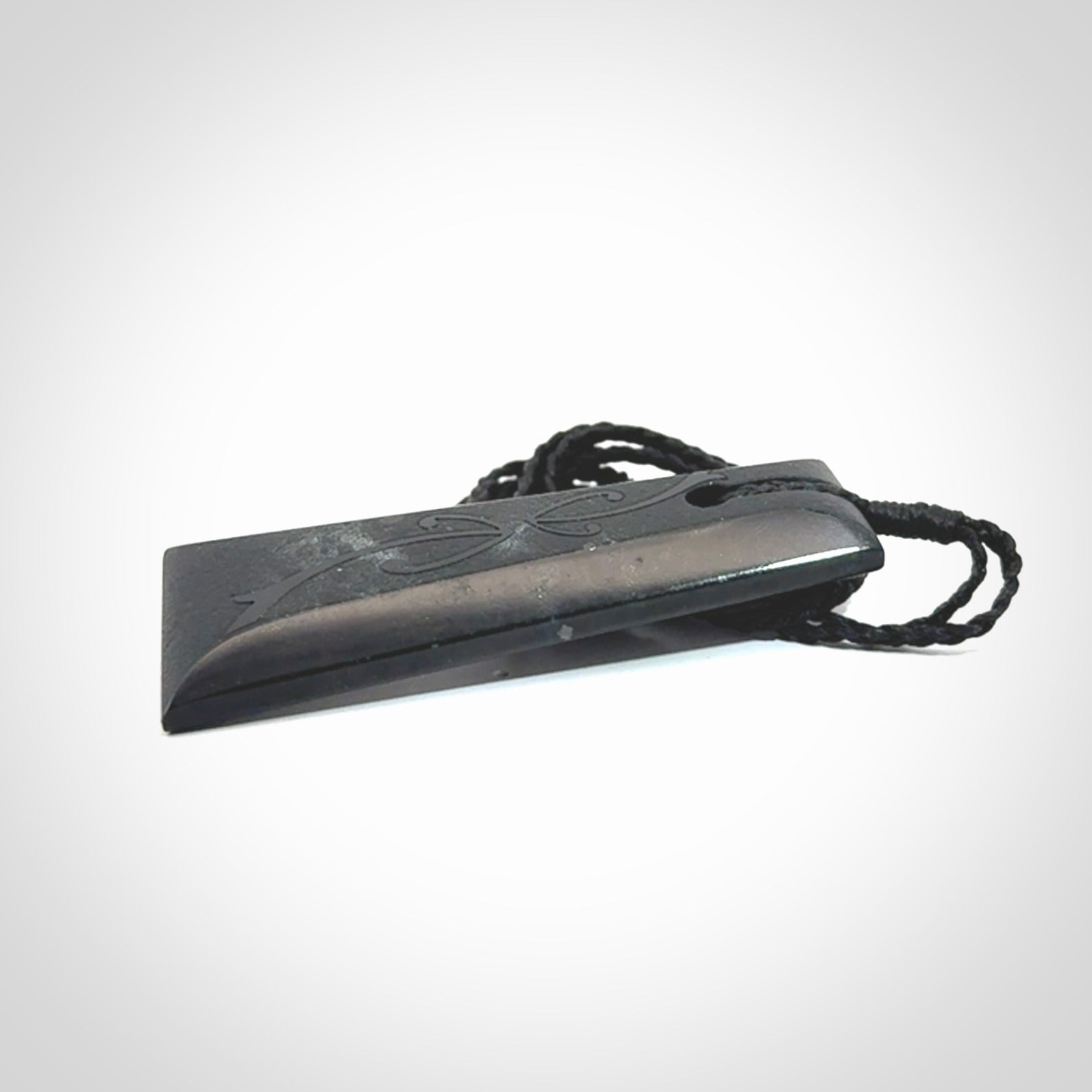 Hand made New Zealand Tangiwai toki with hammerhead engraving pendant. Hand carved in New Zealand by Kerry Thompson. Unique Jade Toki with adjustable cord.