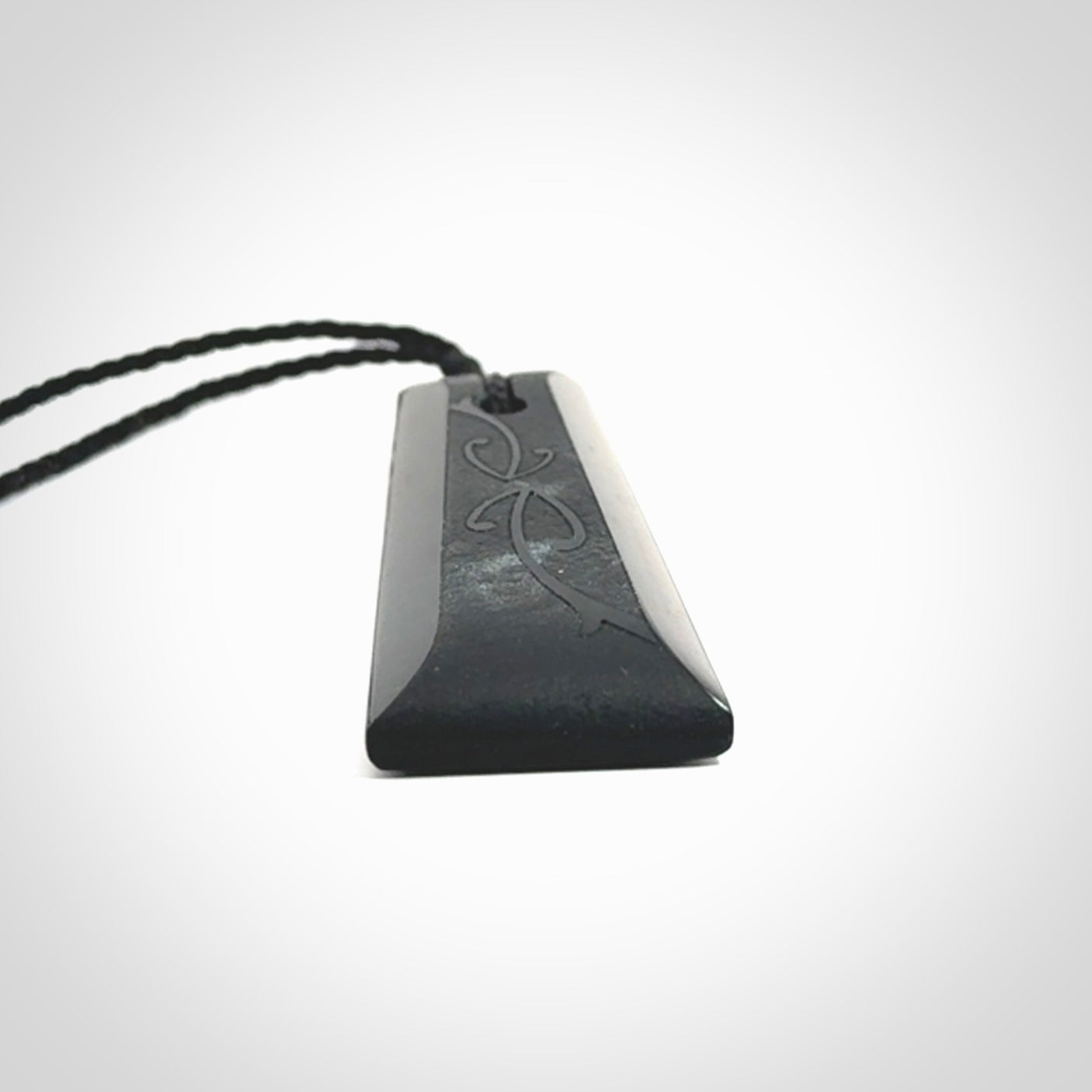 Hand made New Zealand Tangiwai toki with hammerhead engraving pendant. Hand carved in New Zealand by Kerry Thompson. Unique Jade Toki with adjustable cord.