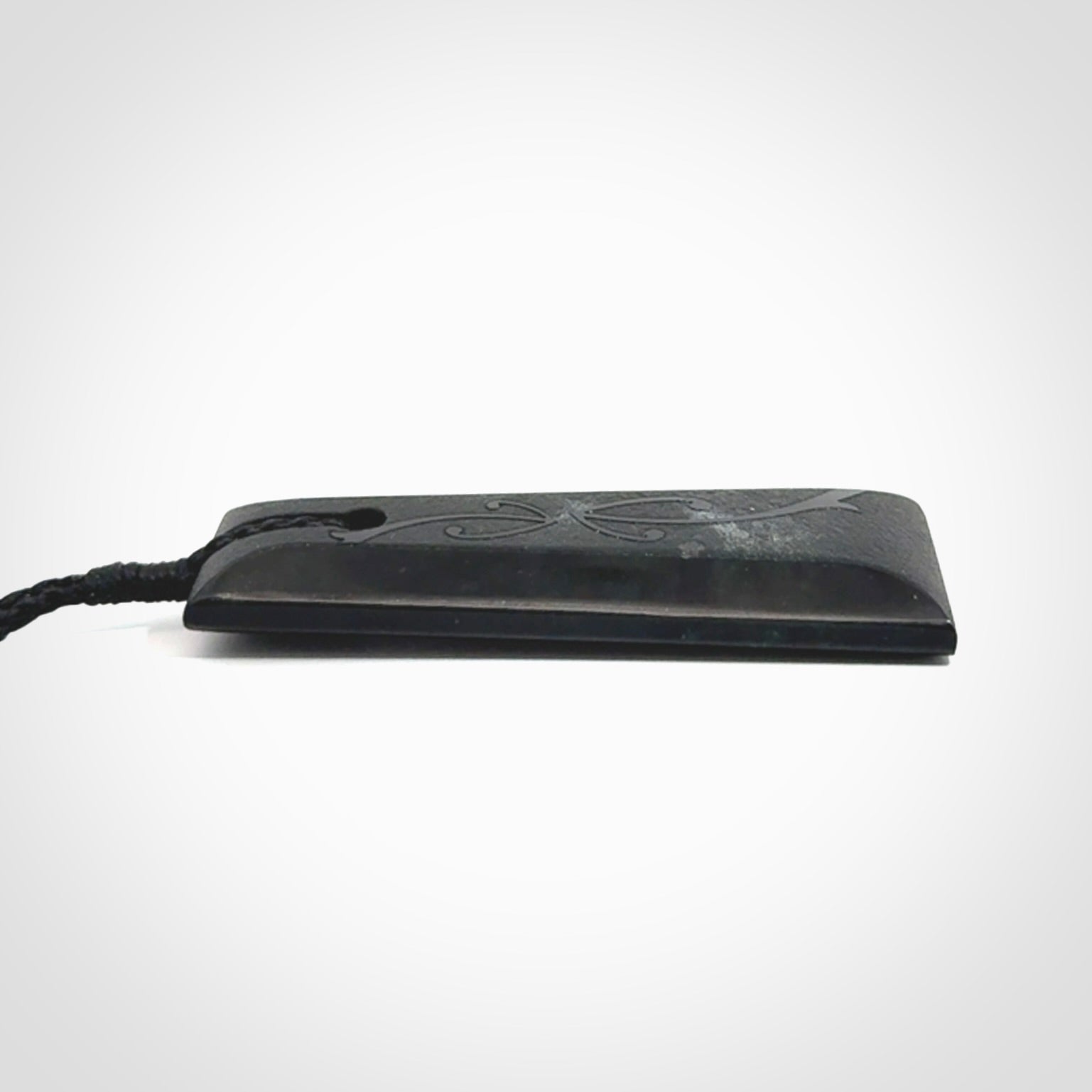 Hand made New Zealand Tangiwai toki with hammerhead engraving pendant. Hand carved in New Zealand by Kerry Thompson. Unique Jade Toki with adjustable cord.