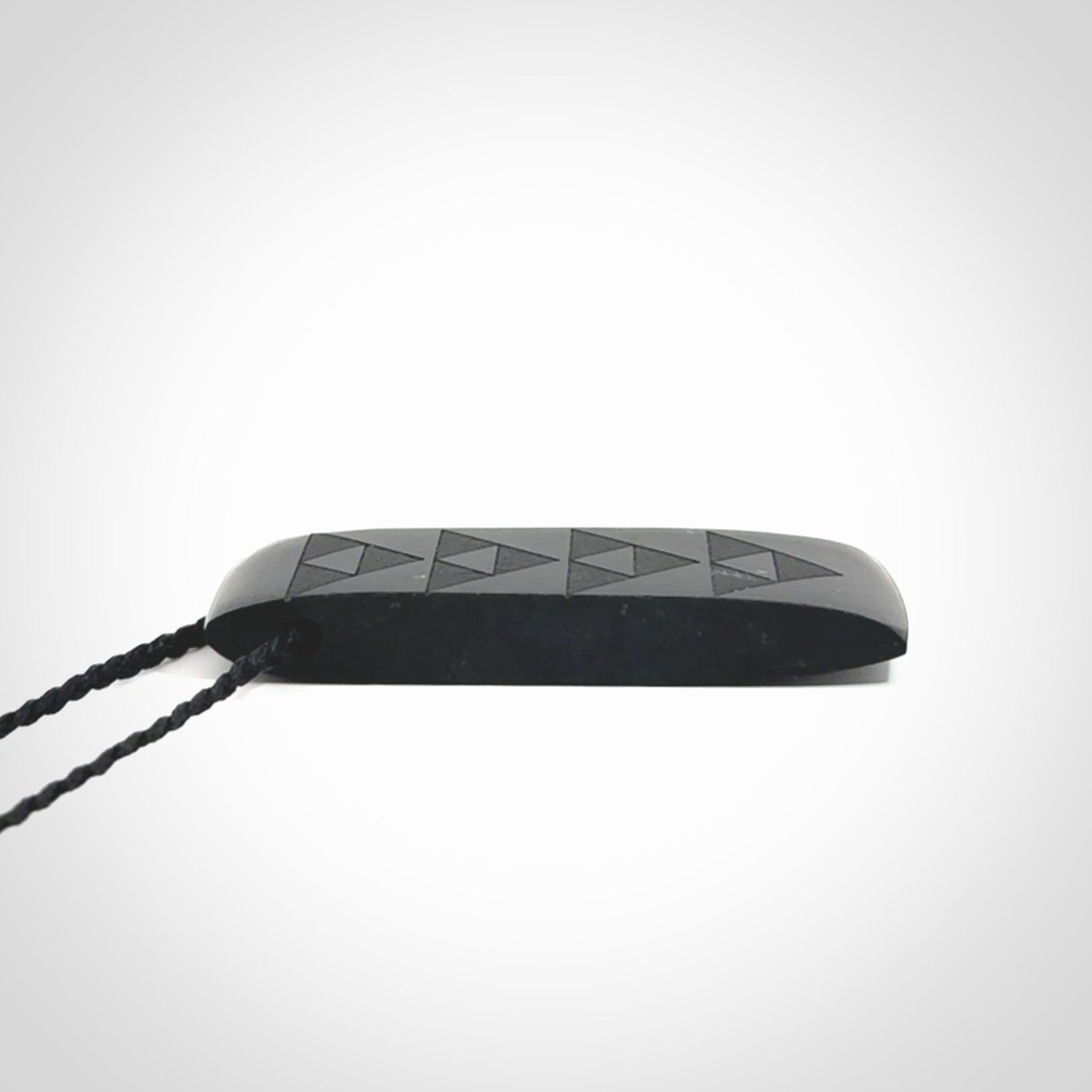 Hand made New Zealand Tangiwai toki with engraving pendant. Hand carved in New Zealand by Kerry Thompson. Unique Jade Toki with adjustable cord.