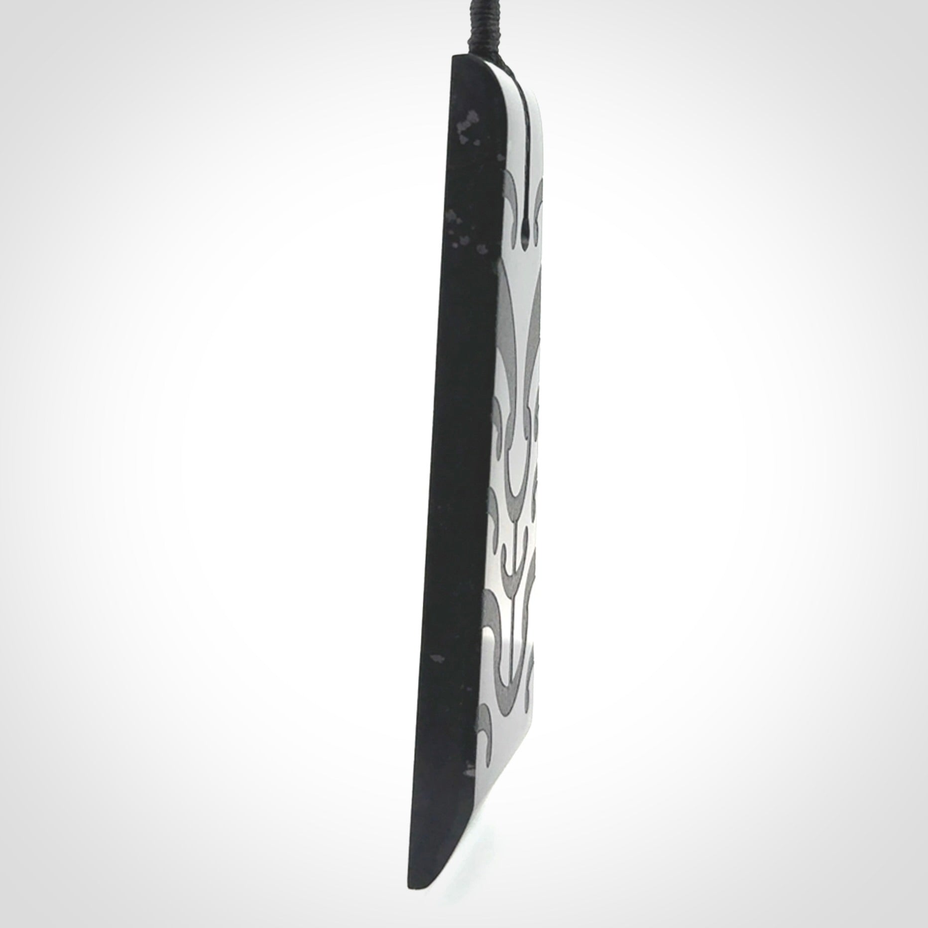 Hand made large New Zealand Tangiwai toki with koru pendant. Hand carved in New Zealand by Kerry Thompson. Unique large Jade Toki with adjustable cord.