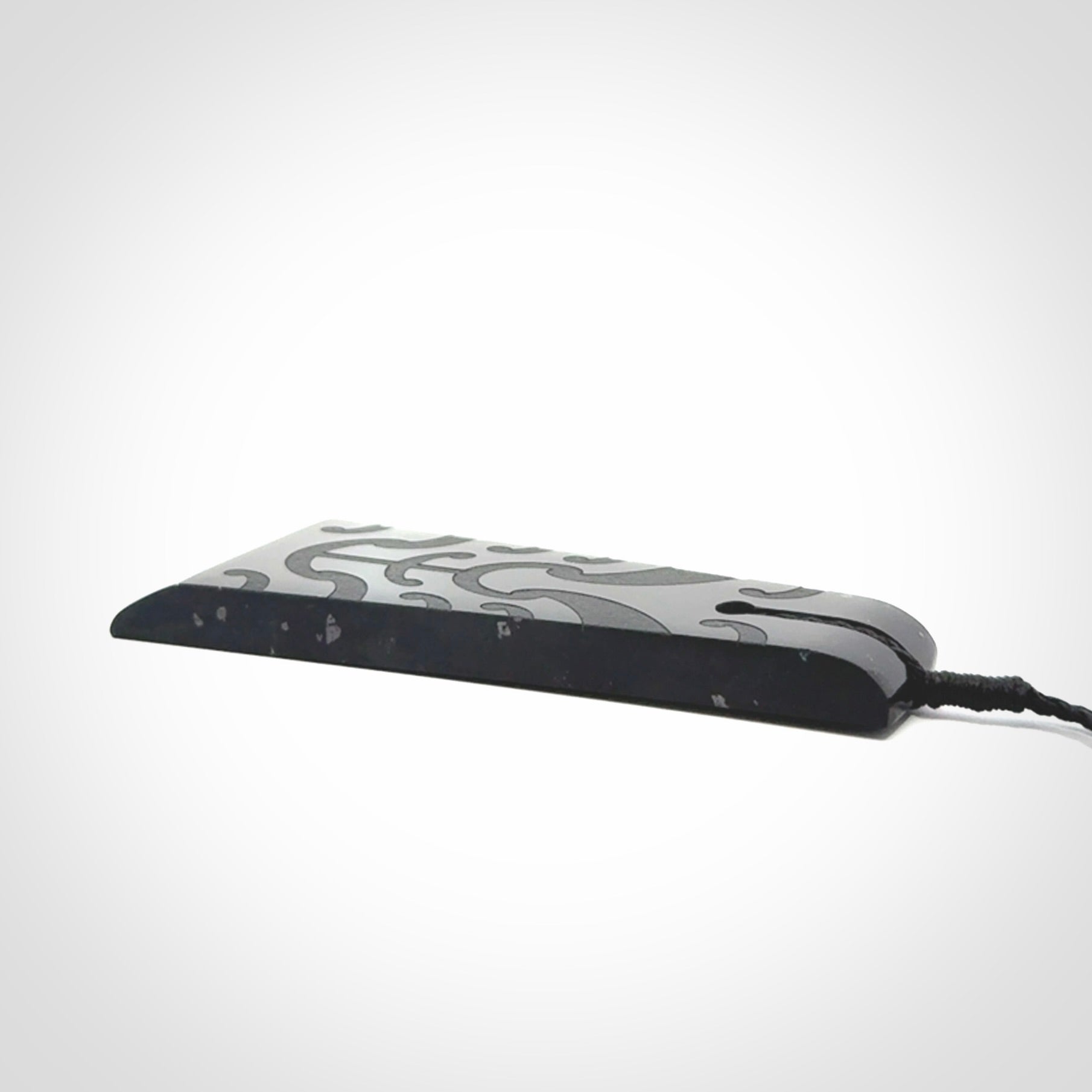 Hand made large New Zealand Tangiwai toki with koru pendant. Hand carved in New Zealand by Kerry Thompson. Unique large Jade Toki with adjustable cord.