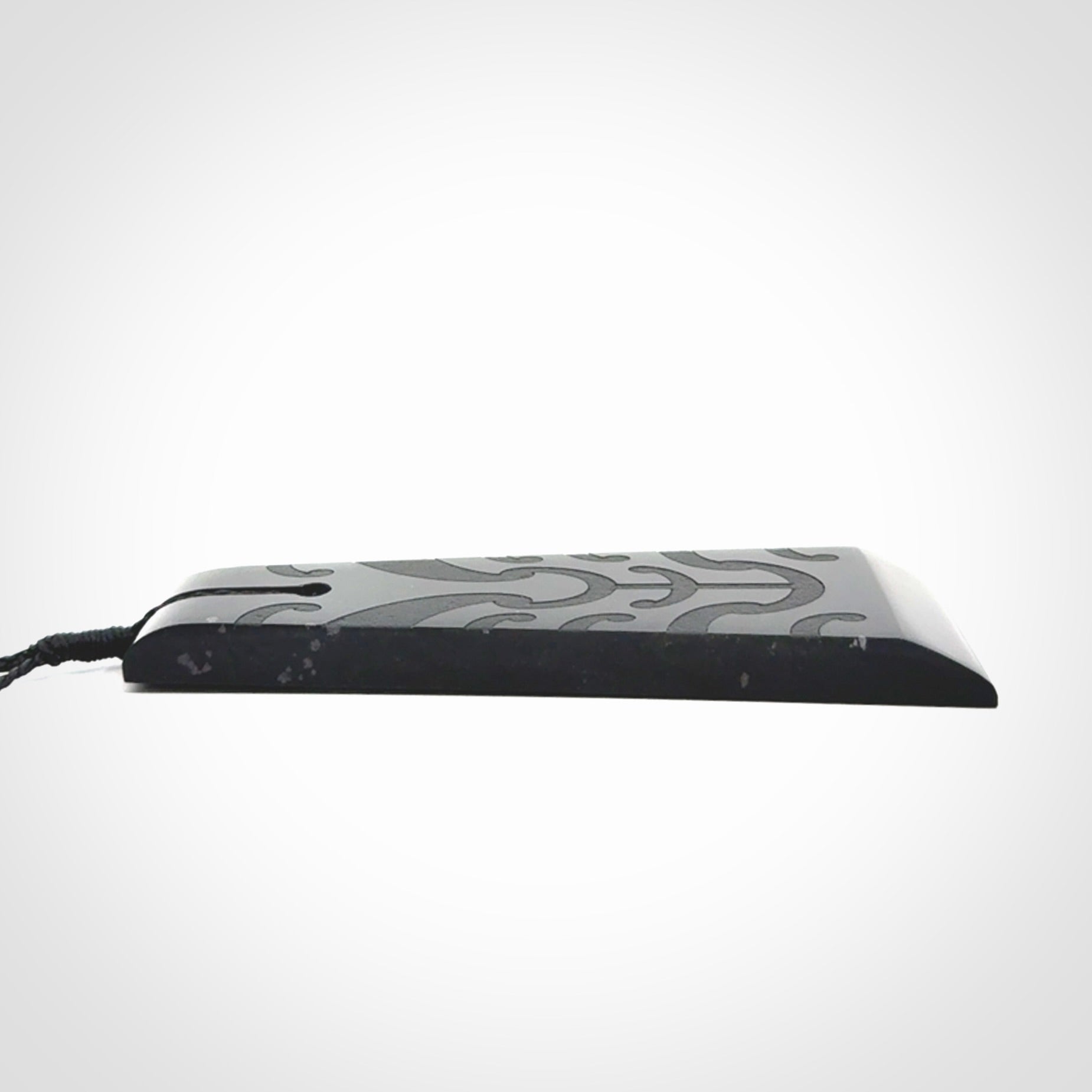 Hand made large New Zealand Tangiwai toki with koru pendant. Hand carved in New Zealand by Kerry Thompson. Unique large Jade Toki with adjustable cord.