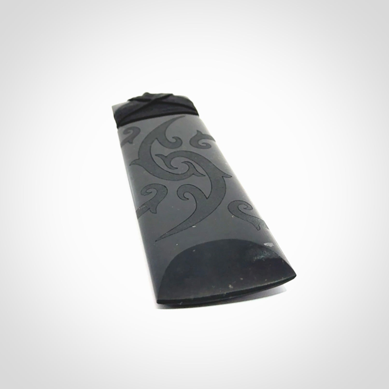 Hand made large New Zealand Tangiwai toki with koru pendant. Hand carved in New Zealand by Kerry Thompson. Unique large Jade Toki with adjustable cord.