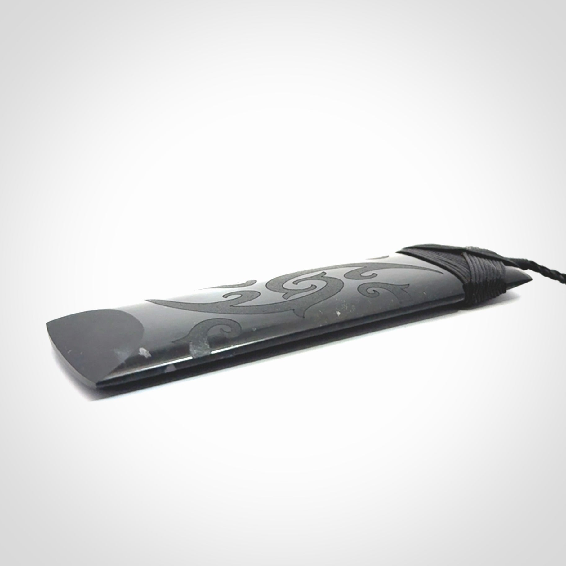 Hand made large New Zealand Tangiwai toki with koru pendant. Hand carved in New Zealand by Kerry Thompson. Unique large Jade Toki with adjustable cord.