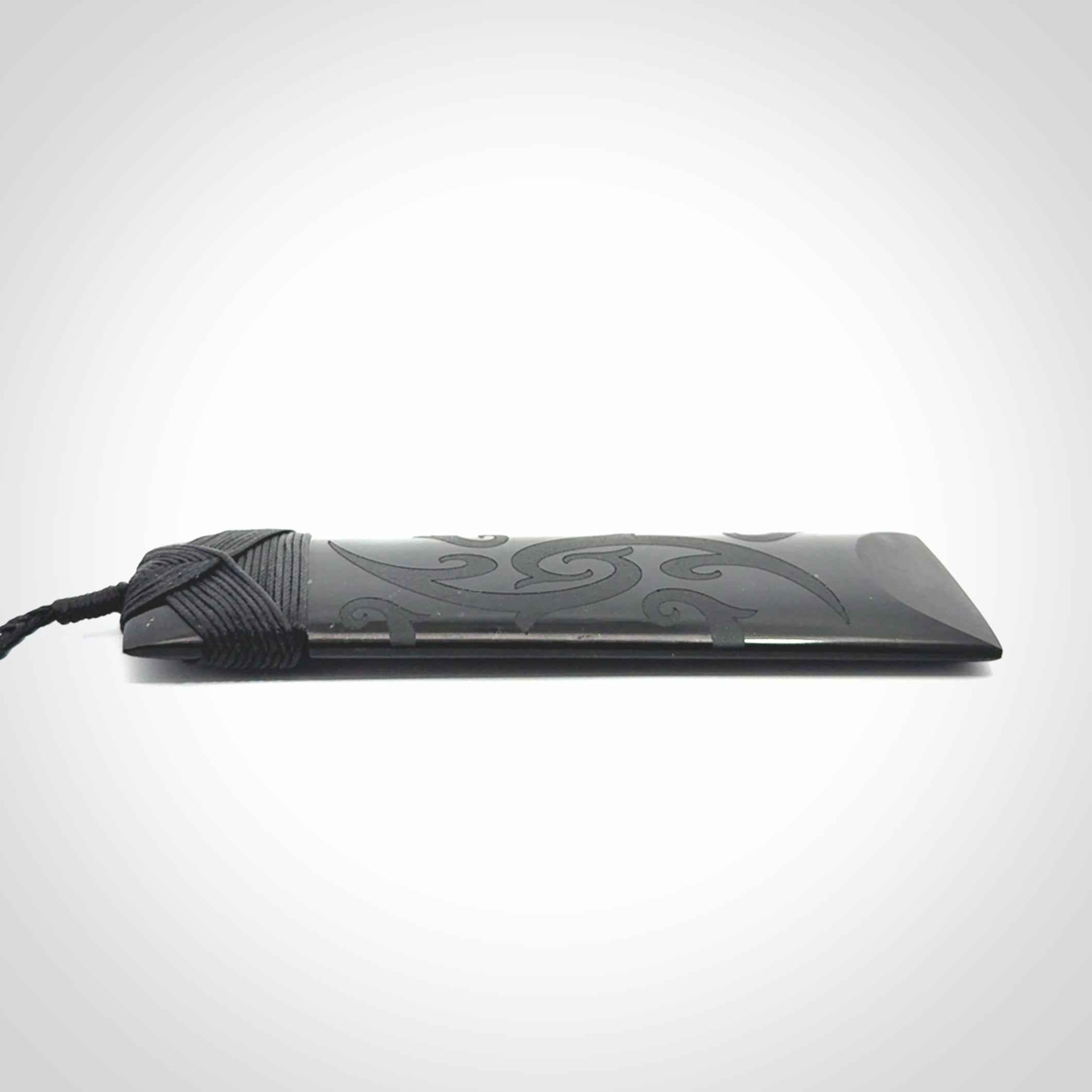 Hand made large New Zealand Tangiwai toki with koru pendant. Hand carved in New Zealand by Kerry Thompson. Unique large Jade Toki with adjustable cord.