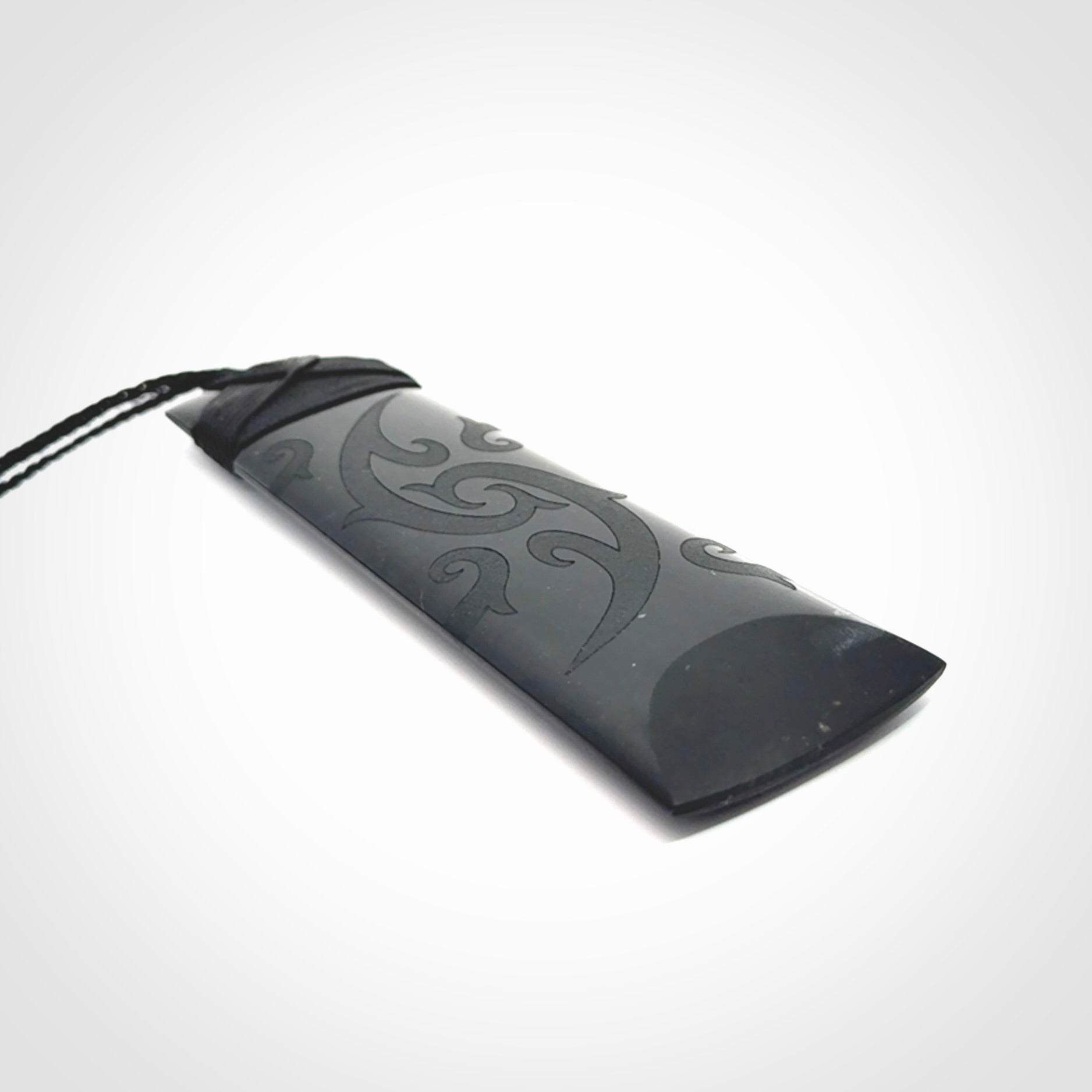 Hand made large New Zealand Tangiwai toki with koru pendant. Hand carved in New Zealand by Kerry Thompson. Unique large Jade Toki with adjustable cord.