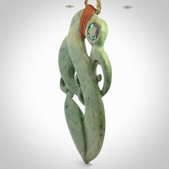 This picture shows a large traditional manaia pendant carved in New Zealand Jade.