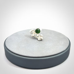 This is a handcrafted New Zealand Pounamu, Jade and sterling silver ring.