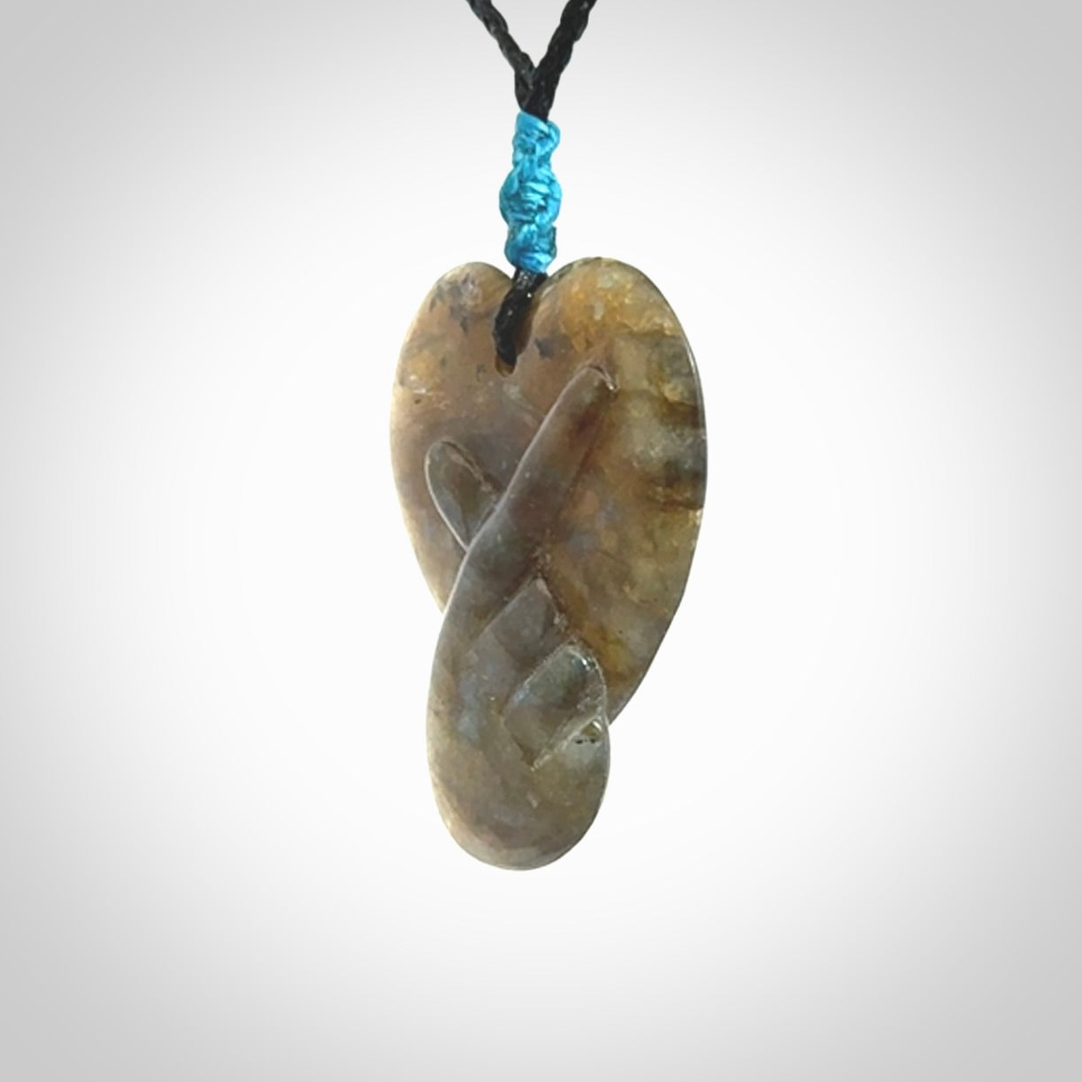 This is a hand carved love heart pendant made from Labradorite stone.