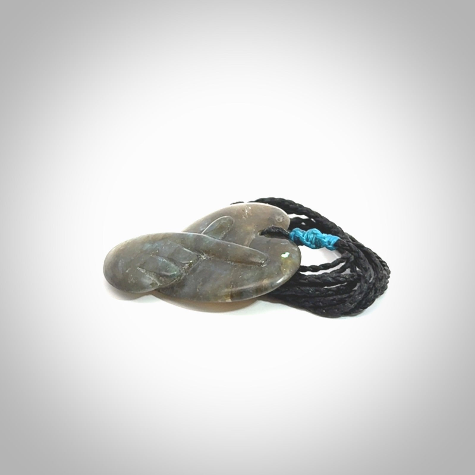 This is a hand carved love heart pendant made from Labradorite stone.