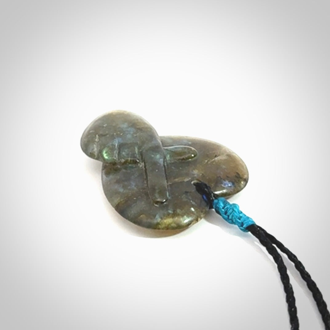 This is a hand carved love heart pendant made from Labradorite stone.