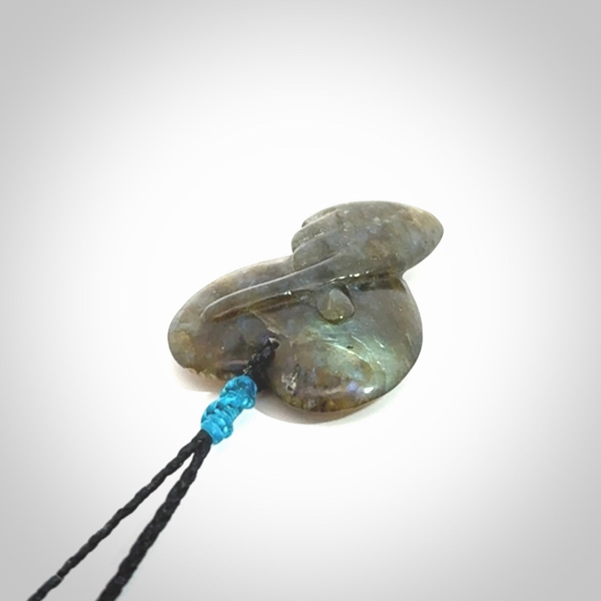 This is a hand carved love heart pendant made from Labradorite stone.
