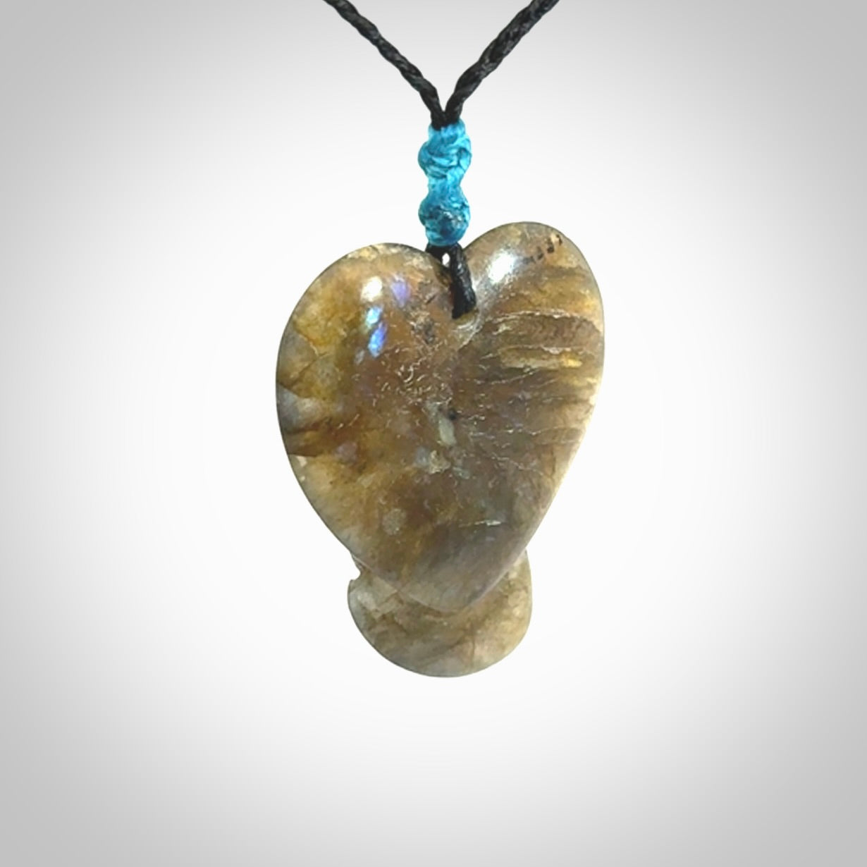 This is a hand carved love heart pendant made from Labradorite stone.