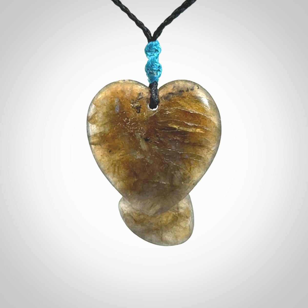 This is a hand carved love heart pendant made from Labradorite stone.