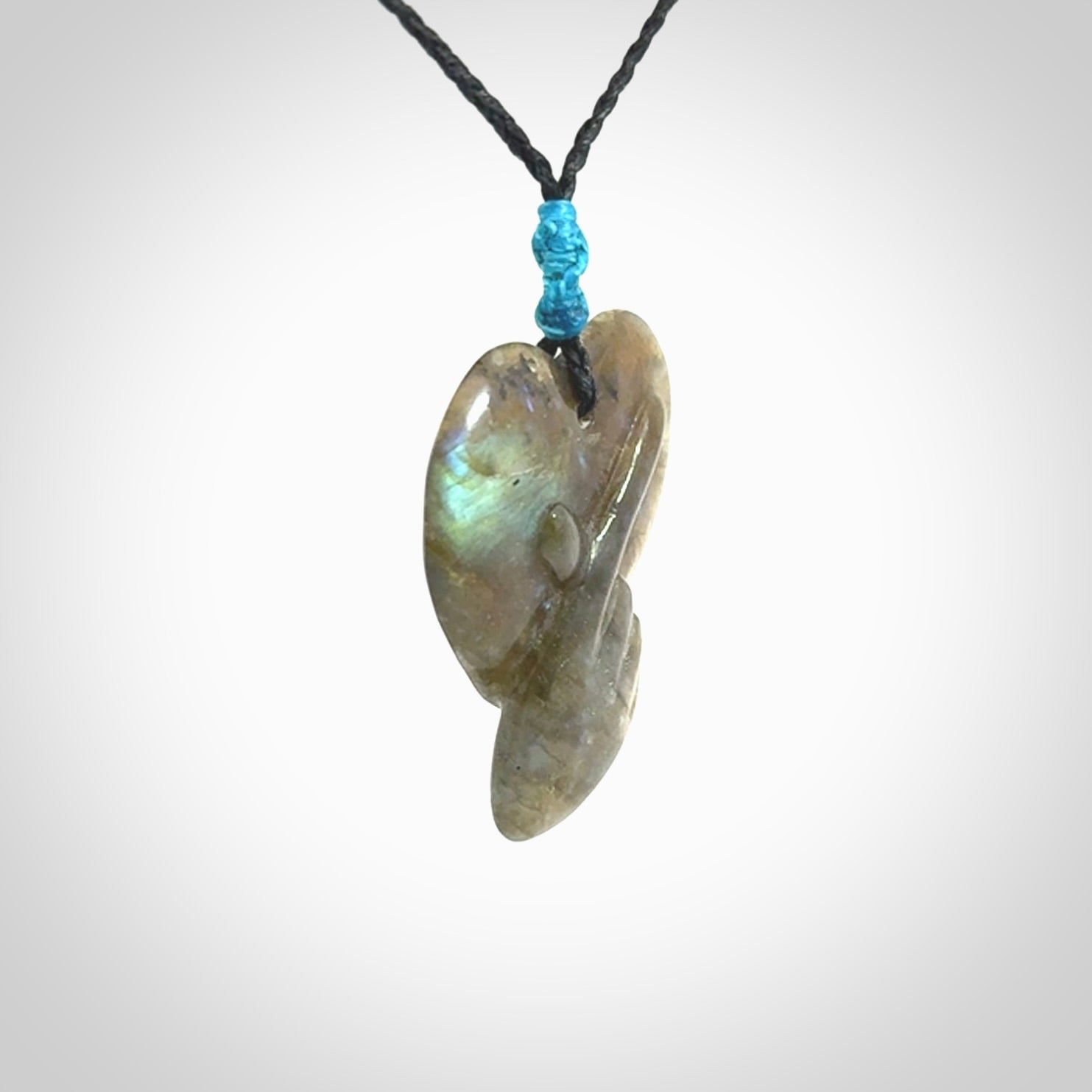 This is a hand carved love heart pendant made from Labradorite stone.