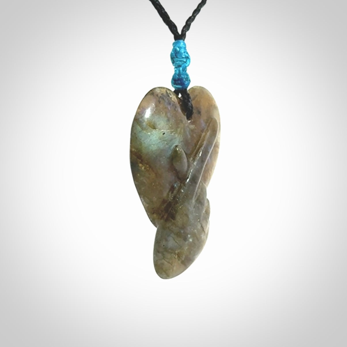 This is a hand carved love heart pendant made from Labradorite stone.