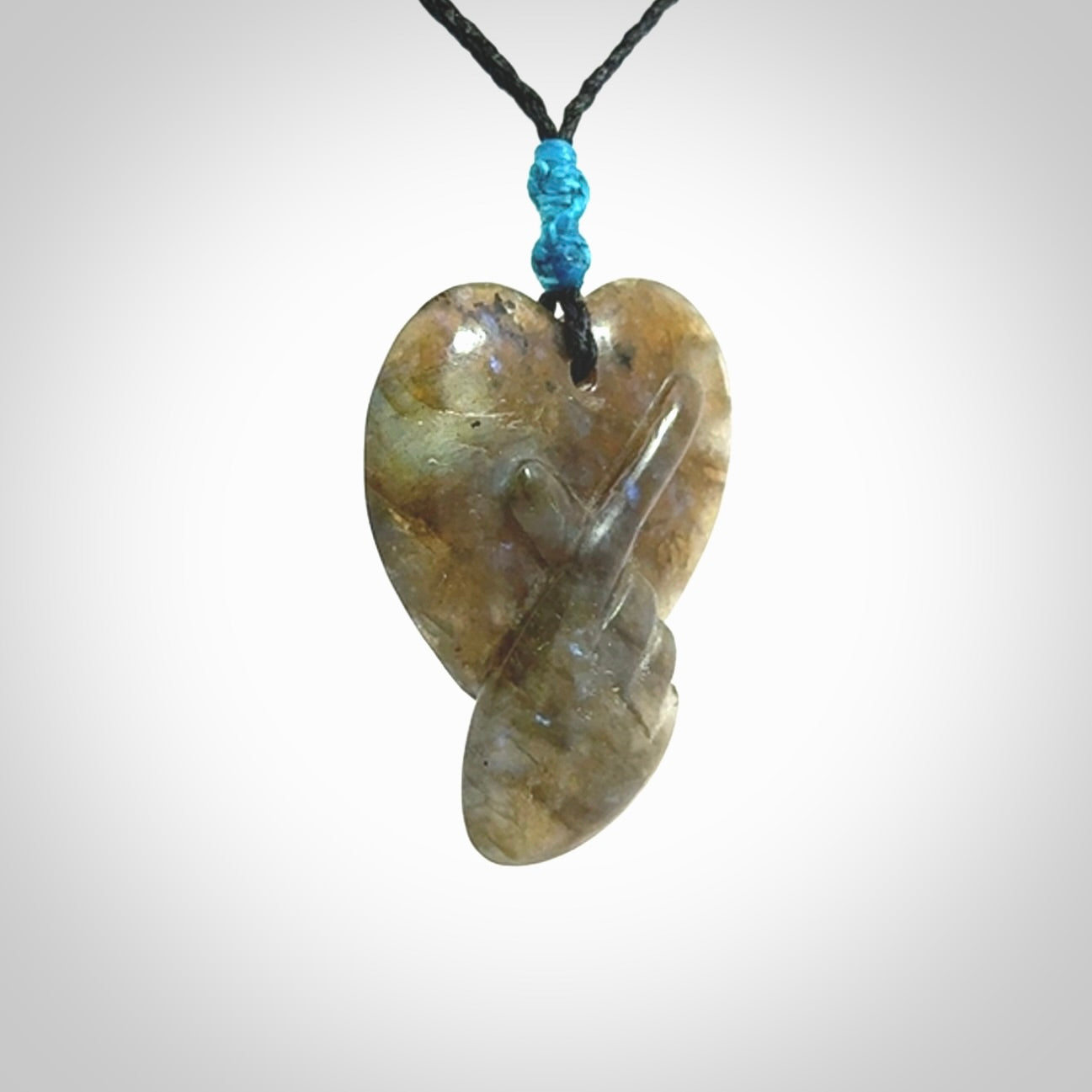 This is a hand carved love heart pendant made from Labradorite stone.