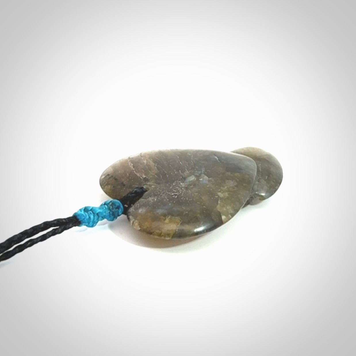 This is a hand carved love heart pendant made from Labradorite stone.
