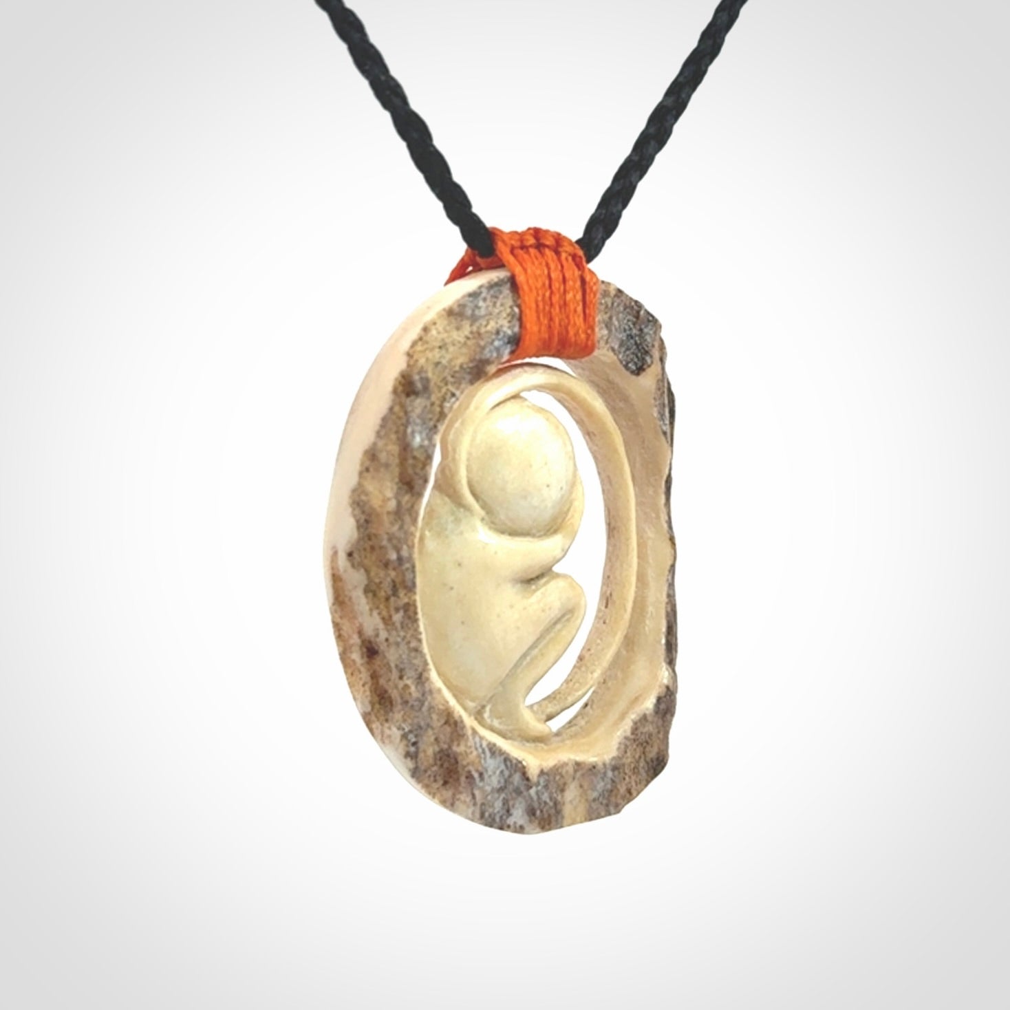 Hand carved deer antler fetus pendant. Hand carved by NZ Pacific. Free postage worldwide. Hand made fetus necklace from deer antler. Fetus necklace for men and women. Delivered with adjustable and packaged in a woven kete pouch.