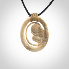 Hand carved deer antler fetus pendant. Hand carved by NZ Pacific. Free postage worldwide. Hand made fetus necklace from deer antler. Fetus necklace for men and women. Delivered with adjustable and packaged in a woven kete pouch.