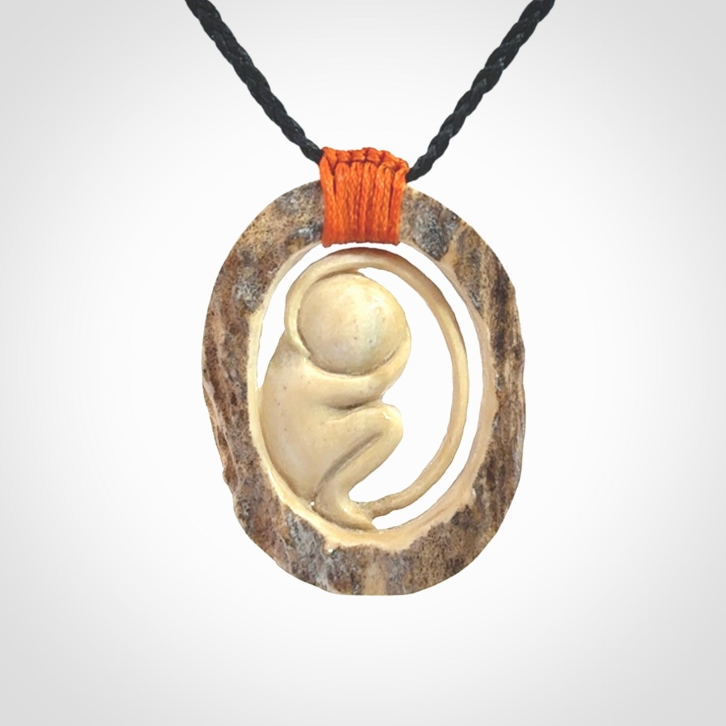 Hand carved deer antler fetus pendant. Hand carved by NZ Pacific. Free postage worldwide. Hand made fetus necklace from deer antler. Fetus necklace for men and women. Delivered with adjustable and packaged in a woven kete pouch.