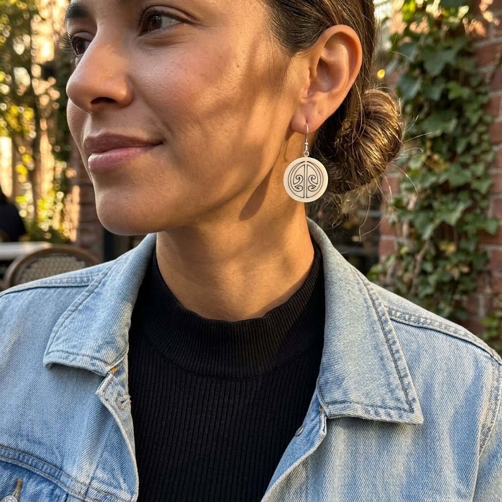 Woman wearing bone earrings