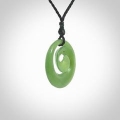 Hand carved New Zealand Kawakawa jade koru pendant. Carved for NZ Pacific by Ross Crump. Jade jewelry for sale online exclusively with NZ Pacific.