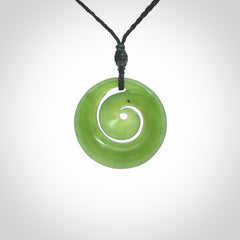 Hand carved New Zealand Kawakawa jade koru pendant. Carved for NZ Pacific by Ross Crump. Jade jewelry for sale online exclusively with NZ Pacific.