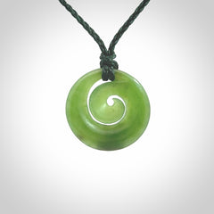 Hand carved New Zealand Kawakawa jade koru pendant. Carved for NZ Pacific by Ross Crump. Jade jewelry for sale online exclusively with NZ Pacific.