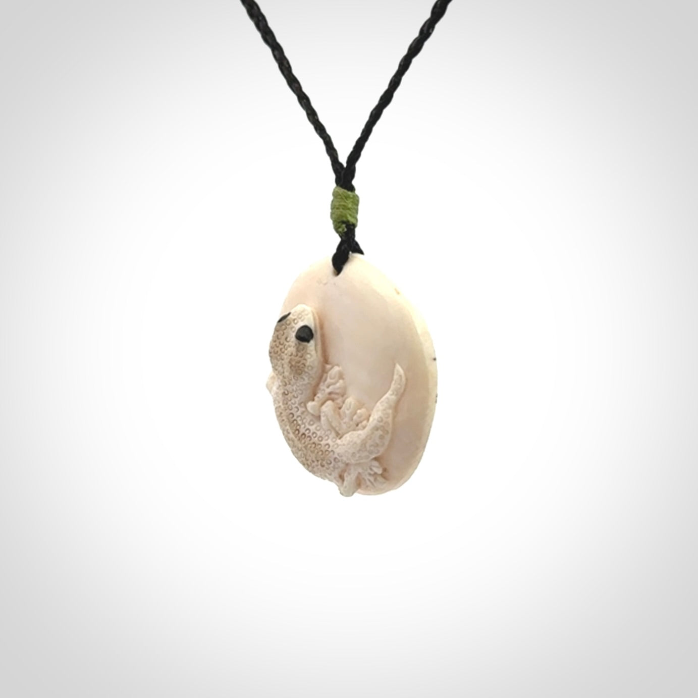 A smiling little lizard pendant
