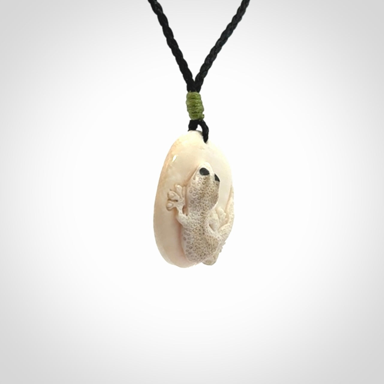 A smiling little lizard pendant