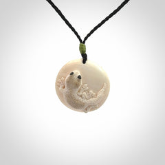 A smiling little lizard pendant