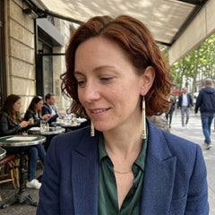 Woman wearing bone earrings