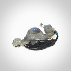 A hand carved labradorite seahorse pendant. We have carved this from beautiful labradorite and we bind them with our hand-plaited cords. The cords are a waxed polyester so they are durable and strong. We ship these worldwide with express courier anywhere in the world.