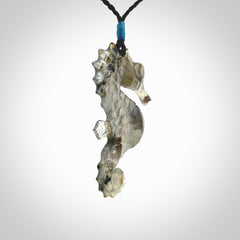 A hand carved labradorite seahorse pendant. We have carved this from beautiful labradorite and we bind them with our hand-plaited cords. The cords are a waxed polyester so they are durable and strong. We ship these worldwide with express courier anywhere in the world.