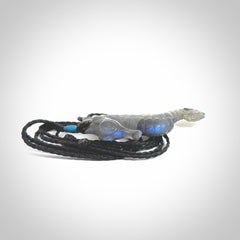 A hand carved labradorite seahorse pendant. We have carved this from beautiful labradorite and we bind them with our hand-plaited cords. The cords are a waxed polyester so they are durable and strong. We ship these worldwide with express courier anywhere in the world.
